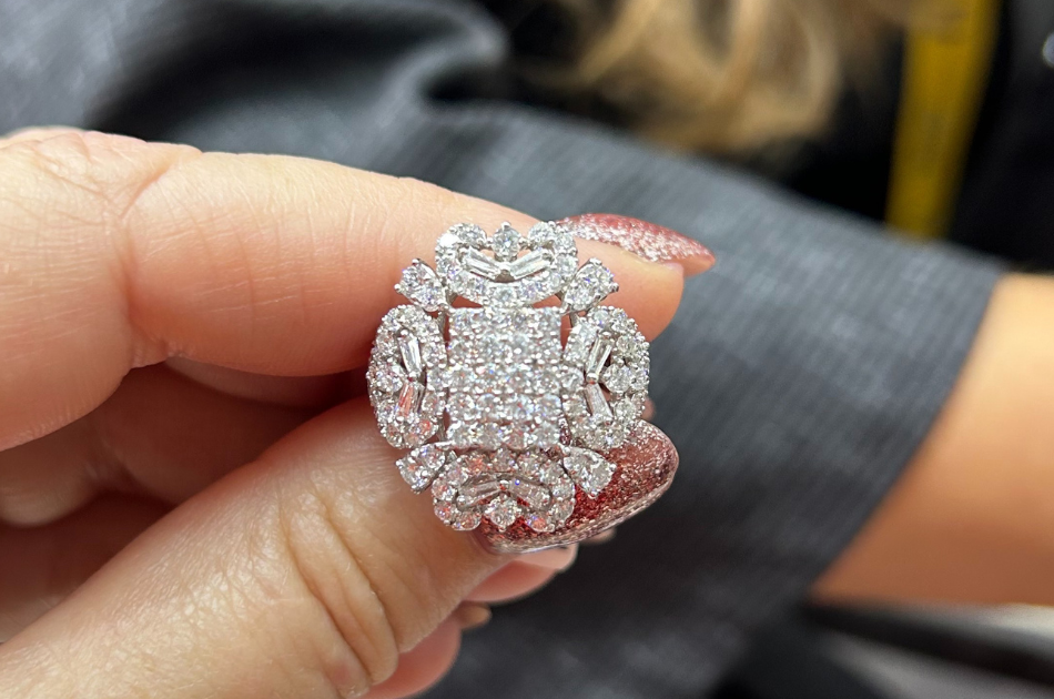 Hand holding diamond ring