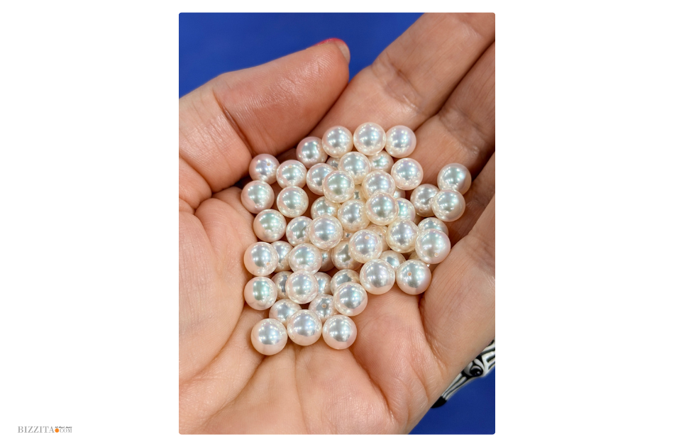 Drilled Akoya pearls held by Esther Ligthart at Otsuki Pearls in Kobe